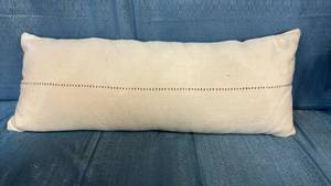 lot 2141 image: Cream Lumbar Pillow with Whipstitched Seam. 35x11