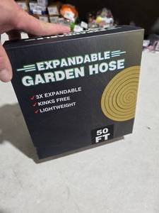 lot 2811 image: 50 ft Garden Hose, Lightweight All-Weather, 10-Function Spray Nozzle