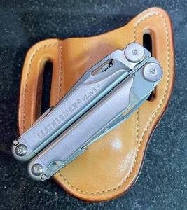 lot 59988 image: classic Leatherman Wave Multi-Tool and its leather storage sheath