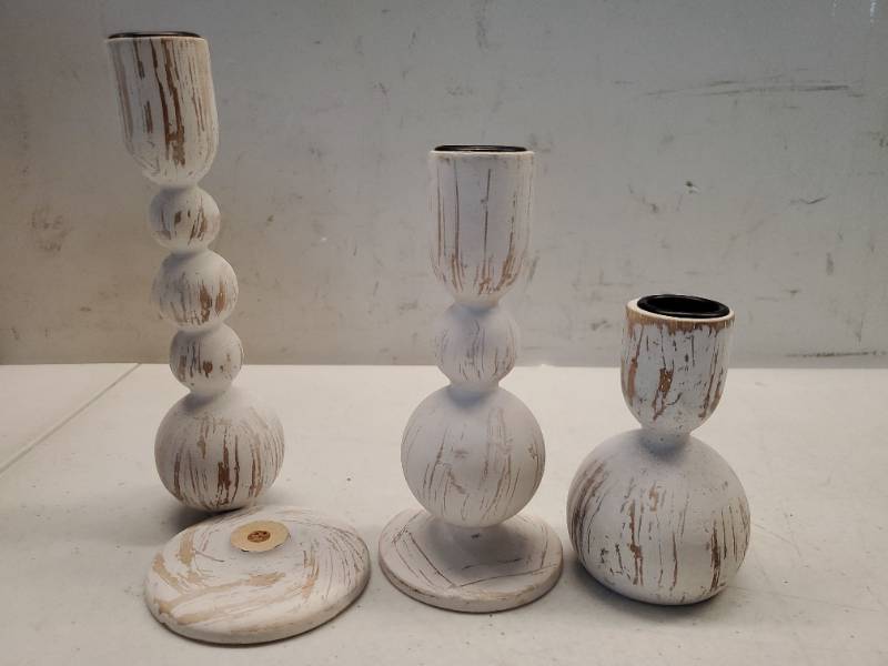lot 63774 image: Taper Candle Holders Decor Set of 3 Wooden Candlestick Holders Mantel Decor - Boho Farmhouse Rustic White (One Needs to Be Glued Back Onto the Stand) - Retail $25