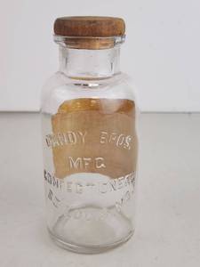 lot 59 image: Antique Candy Bros. MFG Confectioners Glass Bottle with Cork Stopper Saint Louis MO