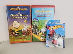 lot 110 image: Peanuts Classic 2-VHS Lot  Hot Wheels Snoopy Die-Cast Car