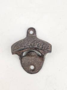 lot 128 image: Coca-Cola Wall Mount Bottle Opener Cast Iron