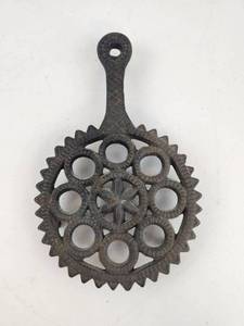 lot 158 image: Cast Iron Trivet with 8 Circular Openings and Handle