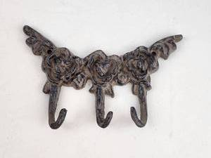 lot 167 image: Cast Iron Ornamental Wall Hook with Three Curved Arms