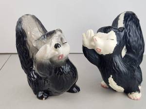 lot 210 image: Pair of Black and White Skunk Figurines Ceramic