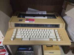lot 6555 image: Vintage IBM Electric Typewriter with Paper Support