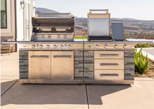 Kirkland Signature Stone Island 12-Burner Gas Grill with Dual Cabinets. Never used but has a couple dings in it shown in pictures so listed as open box - Retail: $4,000