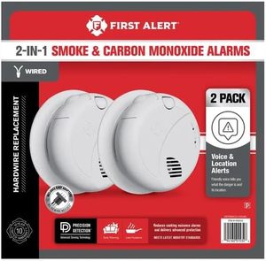 lot 573 image: $106 First Alert Combination Smoke & Carbon Monoxide Alarm, Interconnect Hardwire Detector with Battery Backup and Voice & Location Alerts, SMCO100V-AC, 2-Pack
