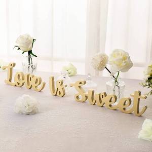 lot 6409 image: Kathfly Love Is Sweet Wooden Letter Sign Set Gold