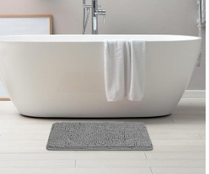 lot 1392 image: Gray fuzzy bathroom carpet approximately 3 ft by 2 ft