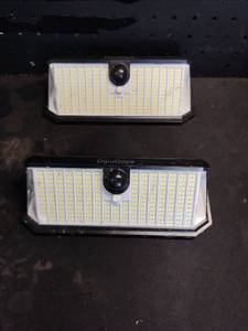 lot 14221 image: DijiuGoya Solar Motion Sensor LED Wall Light 2-Pack