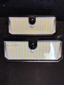 lot 14225 image: DijuGoya Solar Motion Sensor LED Outdoor Wall Lights 2-Pack