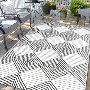 lot 3034 image: Waterproof Outdoor Rug 5x8ft, Foldable Reversible Plastic Straw Mat for Patio RV Deck Porch Backyard Balcony Camping Picnic Beach Indoor Outdoor Carpet, Black&White