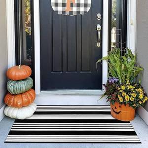 lot 8439 image: OJIA Black and White Striped Outdoor Rug 24x51