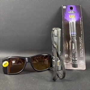 lot 252 image: Stauer Optics Amber Clarity Glasses, Three Color Coleman Flashlight and UV Inspection Light
