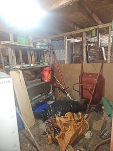 lot 22549 image: Contents of Room - Red Two-Wheel Wheel Barell, Yard Tools and More