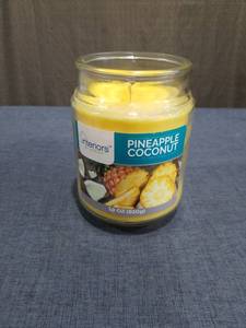 lot 1716 image: Interiors Pineapple Coconut Scented Jar Candle