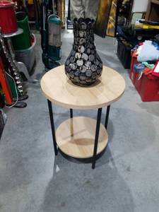 lot 1831 image: Two-Tier Round Side Table with Black Metal Frame and Wood Shelves With Black Vase