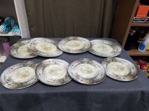 lot 1849 image: 8 Piece Plastic  Plates with Speckled Glaze