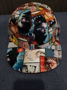 lot 1906 image: Collage Print Baseball Cap with Magazine Imagery