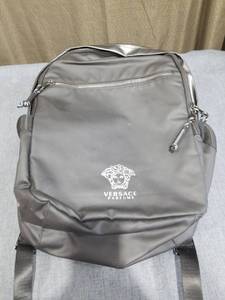 lot 1910 image: Versace Parfums Backpack Gray Medusa Logo
