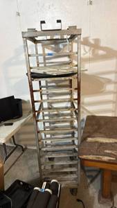 lot 5053 image: Metal Storage Rack with Multiple Shelves and Hanging Bracket - Retail $0