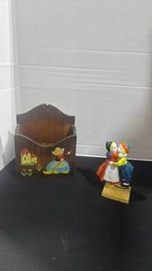 lot 1018 image: Hand-painted kissing Dutch boy and girl toothbrush holder been repaired and wooden wall pocket with Dutch folk art