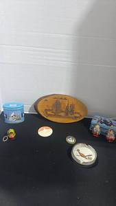 lot 1036 image: Wooden souvenir wall decor, Russian doll keychain and wooden figurines and more