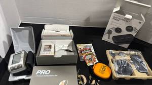 lot 1111 image: Hearing aids, key finders and blood presser cuff