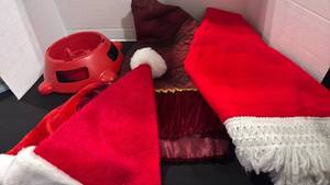 lot 1340 image: Tree skirts, Santa hats and tree stand