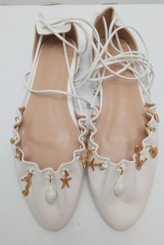 lot 7435 image: Ballet Pointe Shoes with Decorative Charms Pair lace up - size 10
