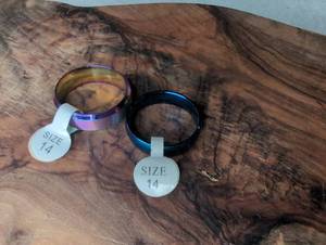 lot 1214 image: 2 Bangle Rings Size 14 Rainbow and Black