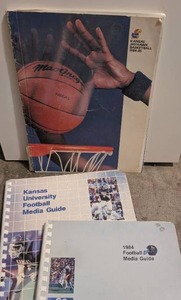 lot 1509 image: Kansas Jayhawk Basketball 1984-85 Media Guide and Football Media Guides Lot