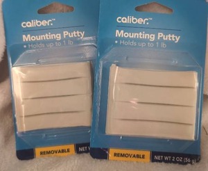 lot 1607 image: Caliber Mounting Putty Removable 1 lb Capacity 2 oz Pack Lot of 2