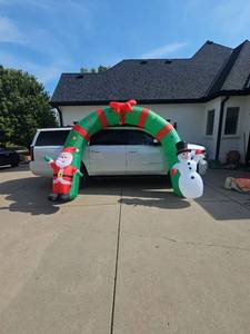 lot 3205 image: Inflatable Christmas Archway Decoration with Santa and Snowman