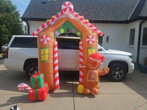lot 3206 image: Inflatable Gingerbread House Holiday Decoration with Gingerbread Man Figure