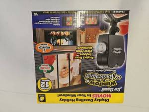 lot 10131 image: As Seen on TV Window Wonderland, ChristmasHalloween Decoration Light Projector
