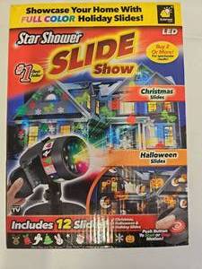 lot 10134 image: As Seen on TV Christmas Star Shower Slide Show, LED Light Projector