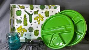 lot 467 image: Plastic tray and plates along with cast iron wheelbarrow and glass jar