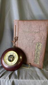 lot 478 image: 1951 Leaves of Gold Book and vintage aneroid barometer made in Germany