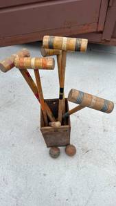 lot 490 image: vintage wooden croquet set featuring traditional multi-colored striped mallets and matching wooden balls