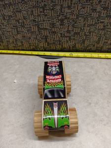lot 1084 image: Grave Digger 4x Champion Bad Bone Wooden Toy Car