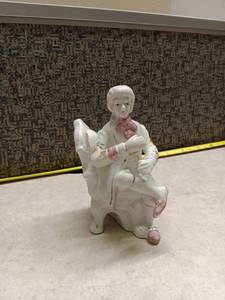 lot 1125 image: Porcelain Figurine Child on White Chair w Pink Accents