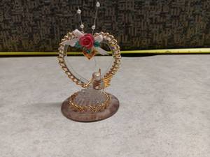 lot 1143 image: Decorative Heart-Shaped Ornament with Wings and Rose