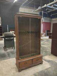 lot 1223 image: Wooden Gun Cabinet with Glass Sliding Doors