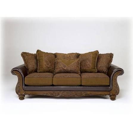 lot 62588 image: Ashley 3460238 Wilmington Sofa with Five Accent Pillows Three Loose Seat Cushions and Carved Wooden Frame in