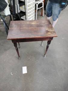 lot 20975 image: antique wooden table with a dark-stained plank top