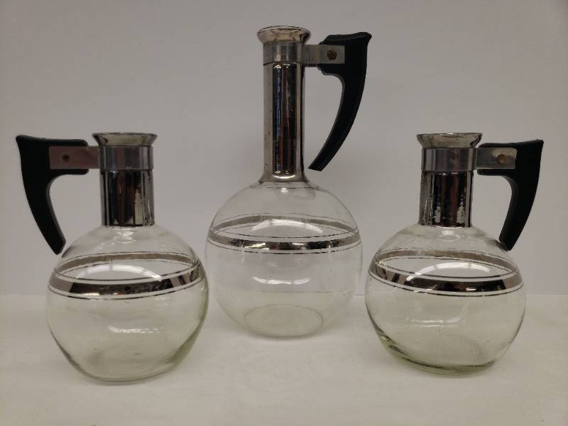 lot 106 image: 1950s-1960s Inland Glass 3 Pc Carafe Set - Silver Necks & Striping - with Bakelite Handles