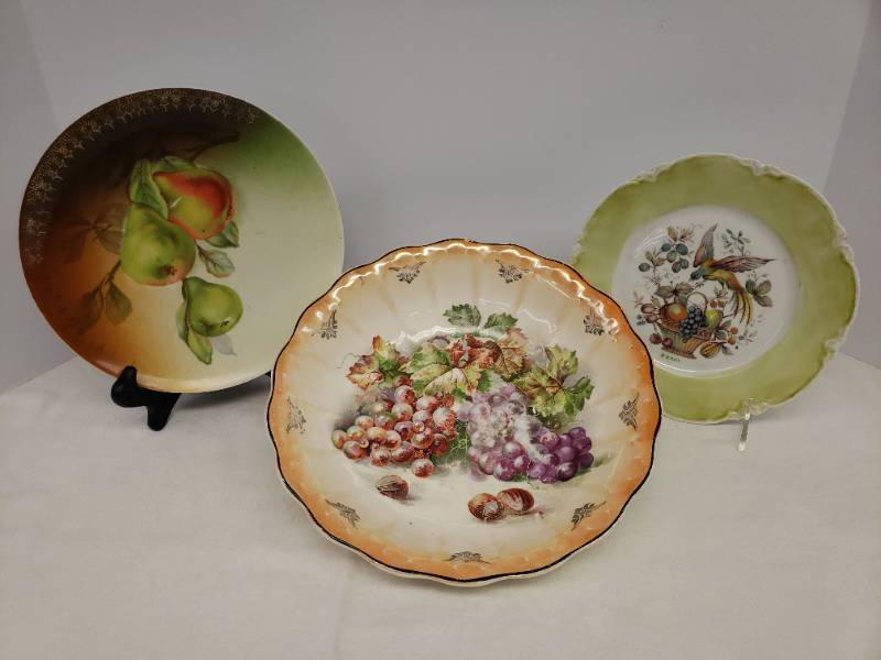 lot 110 image: Antique Hutschenreuther Selb LHS Bavaria Porcelain Hand Painted Plate with Bird of Paradise over Fruit Basket - Signed Zenor, Vintage Gold Trimmed Pear Transferware Porcelain Plate, and Large Vintage Grape Transferware Fruit Bowl